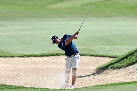Britain's Paul Waring plays on the 2nd hole during the final round of the DP World Tour Championship golf tournament in Abu Dhabi on November 10, 2024.
