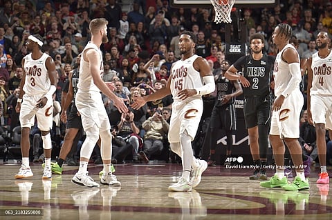 Donovan Mitchell #45 and Sam Merrill #5 of the Cleveland Cavaliers high five during the game against the Brooklyn Nets on November 9, 2024 at Rocket Mortgage FieldHouse in Cleveland, Ohio. NOTE TO USER: User expressly acknowledges and agrees that, by downloading and/or using this Photograph, user is consenting to the terms and conditions of the Getty Images License Agreement. Mandatory Copyright Notice: Copyright 2024 NBAE David Liam Kyle/NBAE via Getty Images/AFP
David Liam Kyle / NBAE / Getty Images / Getty Images via AFP