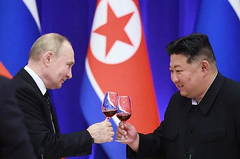 Russian President Vladimir Putin and North Korean leader Kim Jong Un toast during a reception in Pyongyang on June 19, 2024.