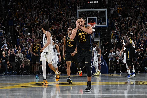 Stephen Curry reacts after delivering the dagger that lifted the Golden State Warriors to a 120-117 win over the Dallas Mavericks in the NBA Cup on Tuesday.