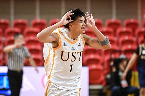 Nickson Cabañero celebrates after playing a key role in UST’s masterful 80-70 win over NUNS in Season 87 UAAP men’s basketball tournament yesterday at the UST Quadricentennial Pavilion.