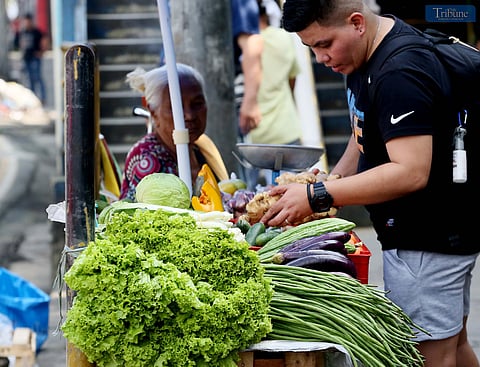 ON FRIDAY, 15 November 2024, a customer purchases vegetables from an 83-year-old vendor at Philcoa, along Commonwealth Avenue in Quezon City. According to the Philippine Statistics Authority (PSA), the region's inflation rate for all income households rises to 1.4% in October 2024, up from 1.2% in September. This brings the average regional inflation rate for January to October 2024 to 3.3%, a notable decrease from the 4.7% inflation rate recorded in October 2023.