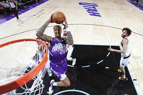 John Collins makes the winning dunk as the Utaz Jazz edged the Dallas Mavericks, 115-113, in their NBA game on Thursday.