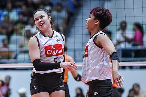 Vanie Gandler (left) and Jovelyn Fernandez celebrate as Cignal scores a 25-18, 25-21, 25-18 win over Farm Fresh in the PVL All-Filipino Conference at the Ynares Center.