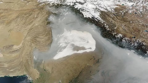 The smog cloud over the snow-capped mountains near India and Pakistan can be seen from space, as this NASA photo shows.