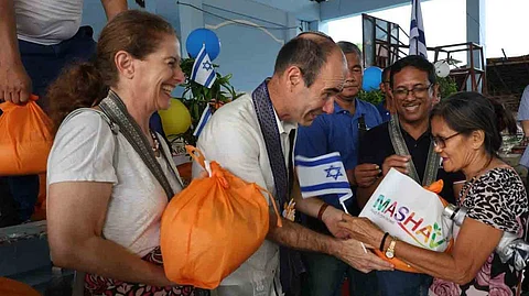 Joy of sharing Israel’s Ambassador Ian Fluss and wife Gila distribute relief packs to families in the Bicol region who were affected by typhoon ‘Kristine.’