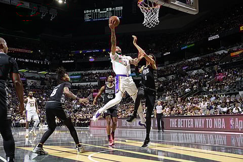 Anthony Davis of the Los Angeles Lakers beats Victory Wembanyama of the San Antonio Spurs in a battle of big men in their NBA game Friday. The Lakers won, 120-115.