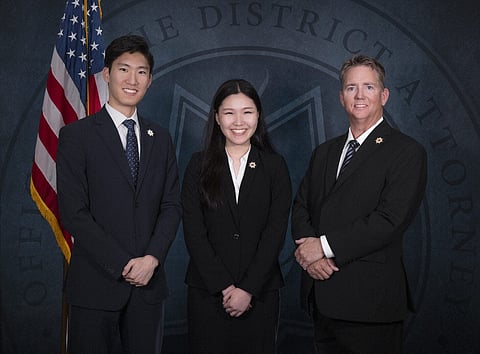 Sophia Park (center) with her brother Peter (left) and Tulare County DA Tim Ward