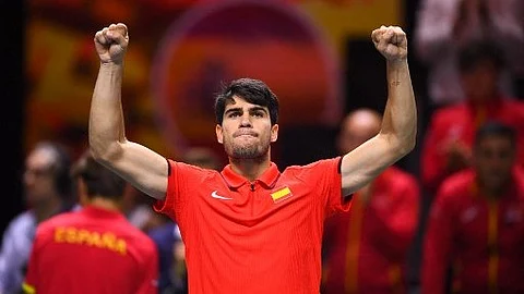 Spain's Carlos Alcaraz celebrates victory at the end of the quarter-final singles match between Netherlands and Spain during the Davis Cup Finals at the Palacio de Deportes Jose Maria Martin Carpena arena in Malaga, southern Spain, on 19 November 2024. Alcaraz won 7-6, 6-3.