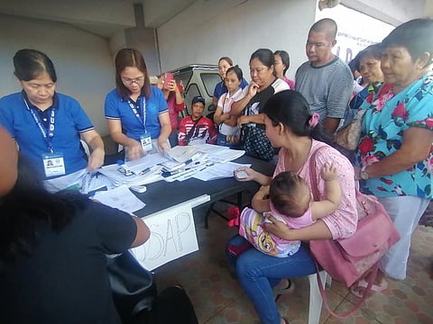DHSUD gives out cash aid, HOMEs to typhoon victims in Albay, Catanduanes