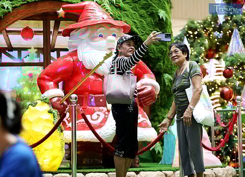 With 34 days until Christmas, mallgoers take photos and selfies at the festive Christmas display at SM North Edsa on Thursday, 21 November 2024.