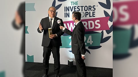 Securities and Exchange Commission Commissioner Javey Paul Francisco (left) received the Overseas Employer of the Year Award from London-based international standard-setting organization, Investors in People, in recognition of its commitment to the growth and well-being of its employees.