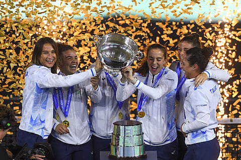 Team Italy celebrates after beating Slovakia to rule the Billie Jean King Cup on Wednesday.