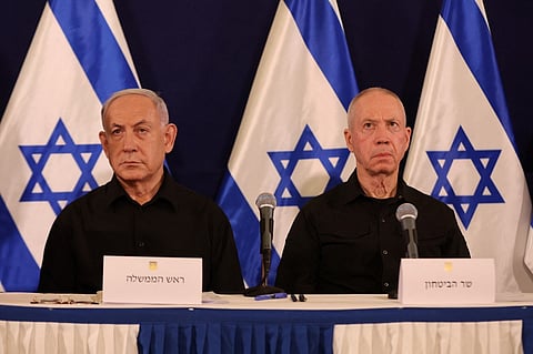 (FILES) Israeli Prime Minister Benjamin Netanyahu (L) and Defence Minister Yoav Gallant attend a press conference in the Kirya military base in Tel Aviv on October 28, 2023.