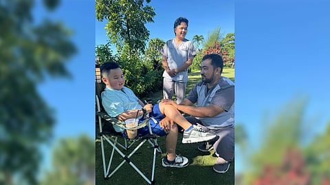 Lucas de Guzman is assisted by physical therapists Khenn Anthony Phati (right) and Christopher Ian Salaveria.