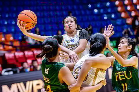 Maylene Solis attacks of the NU Lady Bulldogs attack the heart of the FEU Lady Tamaraws defense during their UAAP Season 87 women’s basketball tournament game on Saturday. The Lady Bulldogs won, 86-58, to punch a ticket to the finals.