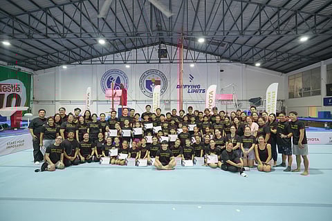 Carlos Yulo (center, seated) takes a photo with the gymnastics camp participants from all over the country during the awarding ceremony. With them are the participants’ parents and guardians, Toyota Motor Philippines representatives led by president Masando Hashimoto and Yulo’s coaching team led by coach Aldrin Castañeda.