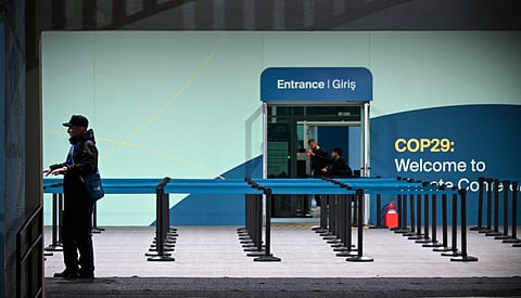 Guards secure the venue for COP 29 Summit in Baku. Developed countries must provide at least $300 billion per year in climate financing to developing countries by 2035 under the Baku Finance Goal, which was the most substantial output of the assembly.