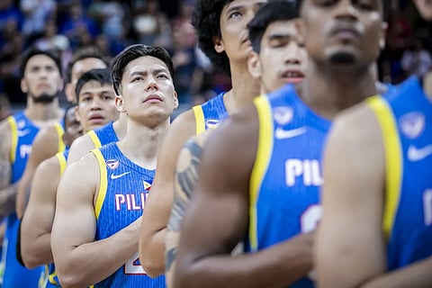 LOOK: Dwight Ramos gets reduced into a mere cheerleader during Gilas Pilipinas’ 93-54 win over Hong Kong in the second window of the FIBA Asia Cup Qualifiers. | FIBA PHOTO