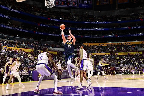 LOS ANGELES, CA - 23 NOVEMBER: Nikola Jokic #15 of the Denver Nuggets drives to the basket during the game against the Los Angeles Lakers on November 23, 2024 at Crypto.Com Arena in Los Angeles, California.