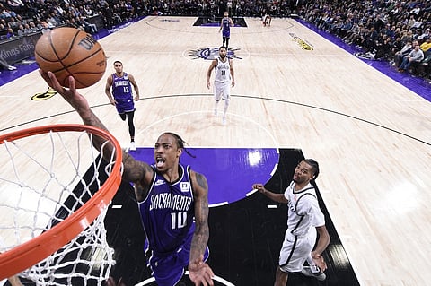 SACRAMENTO, CA - NOVEMBER 24: DeMar DeRozan #10 of the Sacramento Kings shoots the ball during the game against the Brooklyn Nets on November 24, 2024 at Golden 1 Center in Sacramento, California.