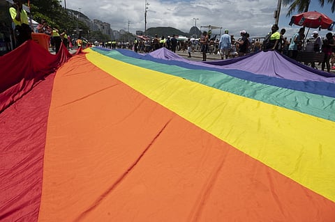 A giant rainbow flag is seen at Copacabana Beach before the start of the annual Pride Parade in Rio de Janeiro, Brazil, on November 24, 2024.