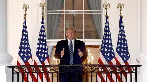 US President Donald Trump gives a thumbs up upon return to the White House from Walter Reed National Military Medical Center on October 05, 2020 in Washington, DC. Trump spent three days hospitalised for coronavirus.