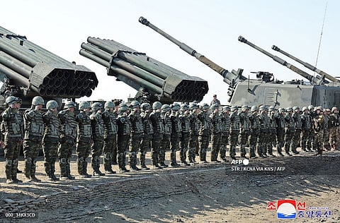 This picture taken on 7 March 2024 and released from North Korea's official Korean Central News Agency (KCNA) via KNS on March 8, 2024 shows troops during a joint forces artillery training exercise at an undisclosed location in North Korea.