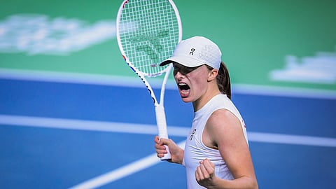 Poland's Iga Swiatek celebrates after winning her match against Spain's Paula Badosa during their singles tennis match between Spain and Poland at the Billie Jean King Cup Finals at the Palacio de Deportes Jose Maria Martin Carpena in Malaga, Spain, on 15 November 2024.