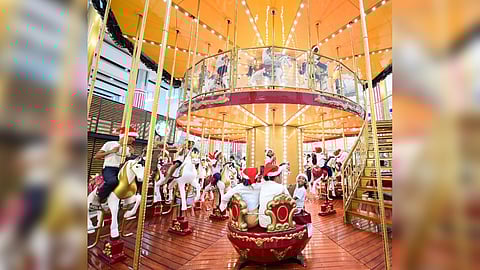 Children from the indigenous communities in Pampanga enjoy a carousel ride at SM City Clark.