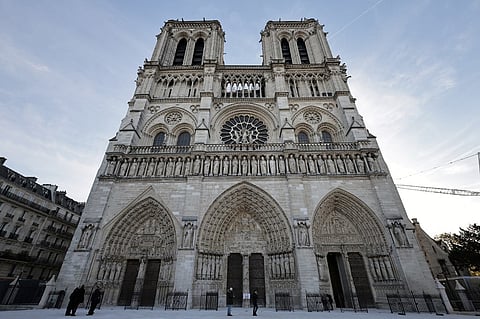 This photograph shows the facade of Notre-Dame de Paris cathedral in Paris, on November 29, 2024, ahead of a visit of the French President. The Notre-Dame Cathedral is set to re-open early December 2024, with a planned weekend of ceremonies on December 7 and 8, 2024, five years after the 2019 fire which ravaged the world heritage landmark and toppled its spire. Some 250 companies and hundreds of experts were mobilized for the five-year restoration costing hundreds of millions of euros.