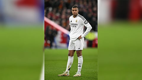 Kylian Mbappe reacts after missing a penalty shot that gave Liverpool a 2-0 win over Real Madrid.