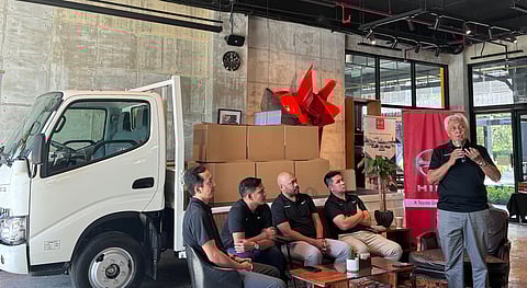 HINO Motors Philippines chairman Vicente Mills (right) and other company executives recount their experiences in a media luncheon that marks their 50-year anniversary celebration recently.