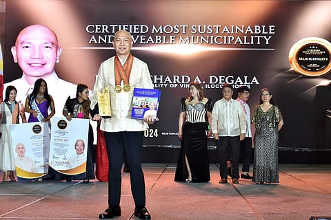 Mayor Richard Agregado Degala celebrates receiving the Local Chief Executive of the Year award, while Vintar, Ilocos Norte is named the Certified Most Sustainable and Livable Municipality during ceremonies at Okada, Manila, on 28 November, 2024. He dedicated this honor to the people of Vintar, emphasizing his commitment to genuine service and sustainable development.