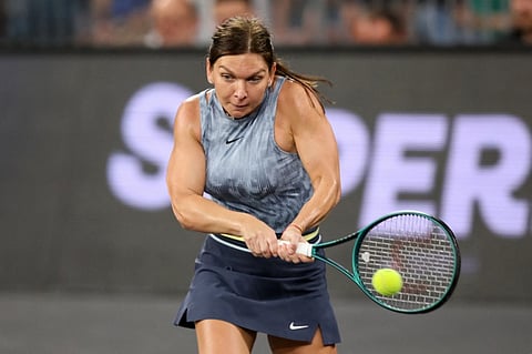 Romania's Simona Halep returns the ball during an exhibition tennis match at the 5th edition of the Sports Festival organized at the BT Arena in Cluj Napoca, Romania on June 15, 2024.