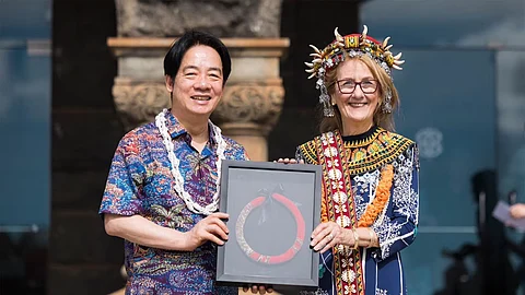 Taiwanese President Lai Ching-te (L) posing with the Bishop Museum Director Dee Jay Mailer in Honolulu, Hawaii.