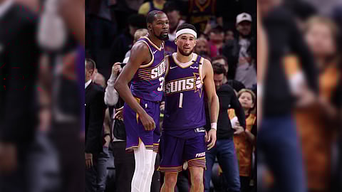 Kevin Durant (left) and Devin Booker provide the telling blows in the Phoenix Suns’ 113-105 victory over the Golden State Warriors in their NBA regular season game.