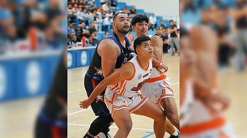 BRANDON Ramirez (right) plays with a heavy heart in leading the Pampanga Giant Lanterns to an 88-71 win over Quezon Province in Game 1 of their MPBL best-of-five finals series in Dubai.