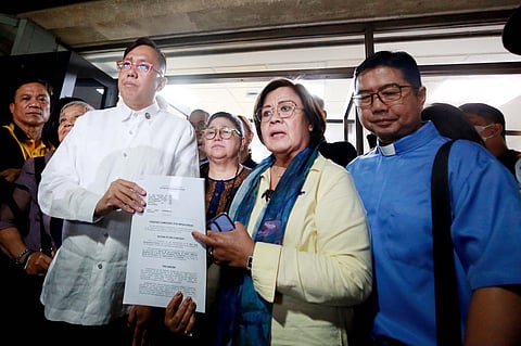Signed, delivered Former Senator Leila de Lima accompanies civil society and other groups in submitting to Rep. Perci Cendana (third from left) an impeachment complaint against Vice President Sara Duterte on Monday at the House of Representatives.