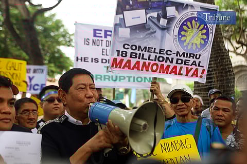 Former Caloocan Congressman Edgar "Egay" Erice protested outside the Comelec office in Intramuros on Monday, 2 December, as he prepared to file a motion for reconsideration on his disqualification case. Erice criticized Comelec Chair George Erwin Garcia and the P18 billion contract for the 2025 elections.