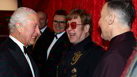 Britain's King Charles III reacts as he meets Elton John (2R) and David Furnish (R) as he attends the Royal Variety Performance at the Royal Albert Hall in London on 22 November 2024. The Royal Variety Performance takes place every year in aid of the Royal Variety Charity. The money raised from the show helps hundreds of entertainers throughout the UK, who need help and assistance.