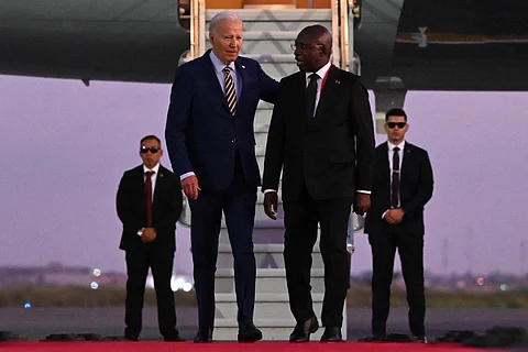 US President Joe Biden (3rd R) walks on the red carpet next to Angola Foreign Affairs Minister Tete Antonio (2nd R) upon his arrival at the Quatro de Fevereiro Luanda International Airport in Luanda on December 2, 2024.
ANDREW CABALLERO-REYNOLDS / AFP
