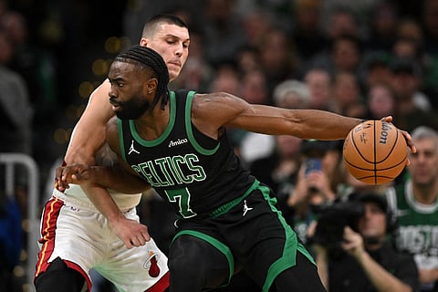 Jaylen Brown of the Boston Celtics attacks the defense of Tyler Herro of the Miami Heat during their NBA regular season game. The Celtics prevailed, 108-89.