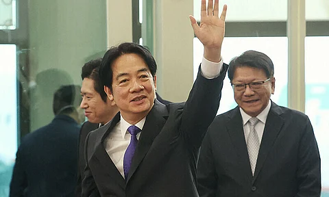 Taiwan’s President Lai Ching-te waves at Taoyuan International Airport in Taoyuan on November 30, 2024 before his trip to visit Taiwan’s allies in the Pacific. Lai will leave on November 30 on a week-long tour of the Pacific that includes a stopover in Hawaii, which has ignited fiery threats from Beijing.