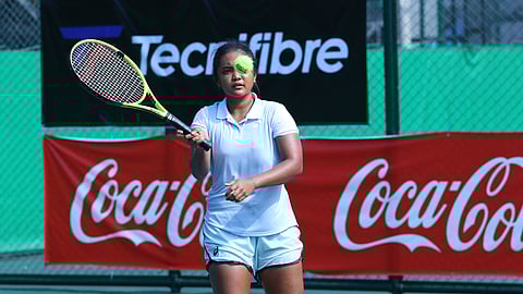 Tennielle Madis makes a forehand return to Indonesian Joanne Lyn Hartono during their second-round match in the Coca-Cola PHILTA International Juniors 2 at the Rizal Memorial Tennis Center on Thursday. Madis won, 6-1, 6-1.