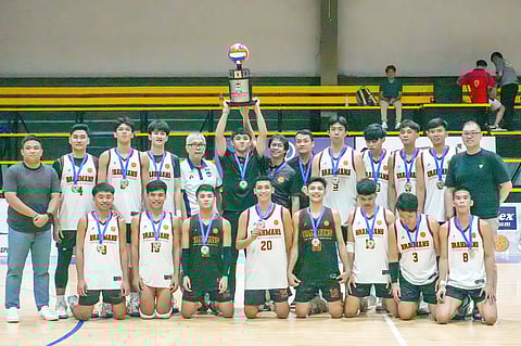 Members of the victorious University of Batangas pose with UCAL officials led by Horacio Lim, Bernard Yang and Carmelo Navarro after winning the league’s men’s volleyball crown on Friday.