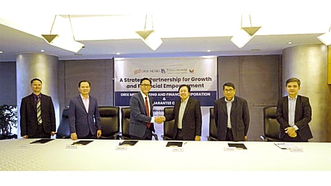 ORIX Metro president Angelo Padua (third from left) and PHILGUARANTEE president and chief executive officer Alberto Pascual (fourth from left) committed to provide credit to more micro, small and medium enterprises through a signing ceremony on this financial partnership between the two institutions on 27 November.