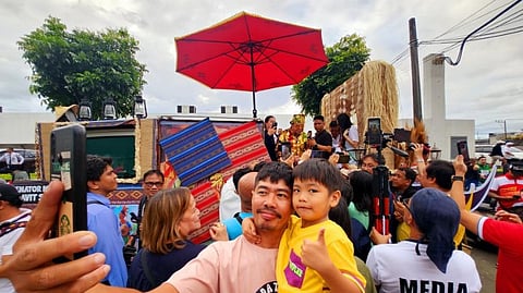 Senatorial candidate Luis ‘Manong Chavit’ Singson draws a diverse group of supporters during his campaign sorties, including this man, who was seen taking a selfie with his son in front of the float carrying Manong Chavit during the ‘Sumbingtik’ grand parade in Cainta, Rizal, last week. In an interview with reporters, Singson urged the camps of President Ferdinand Marcos Jr. and Vice President Sara Duterte to put aside their differences and focus their efforts on addressing the nation’s pressing issues.