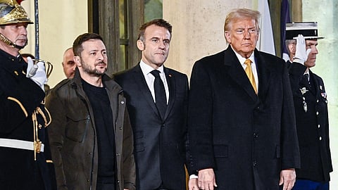 PHOTO: France's President Emmanuel Macron, flanked by President-elect Donald Trump and Ukraine's President Volodymyr Zelensky leave after a meeting at The Elysee Presidential Palace in Paris, on Dec. 7, 2024.