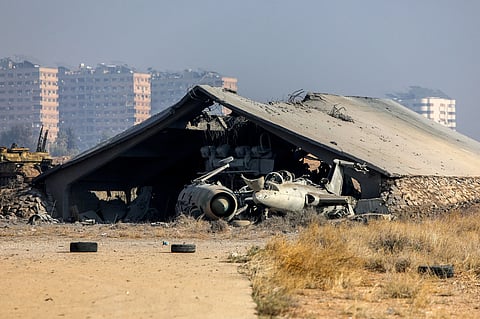 This picture shows a burned Syrian army helicopter after Israeli strikes said to target weapons depots near the Mezzeh military airbase, outside Damascus, on December 9, 2024.
